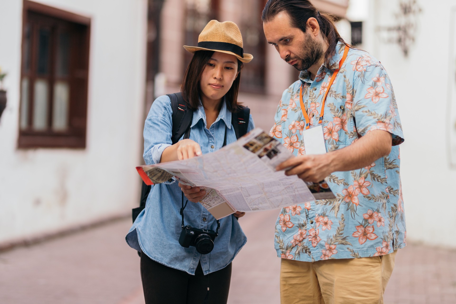 Japanese young woman asking for direction to tour guide